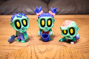Blob Zombies 3D printed zombie figures — the Gravedigger, the Girl, and the Crawler